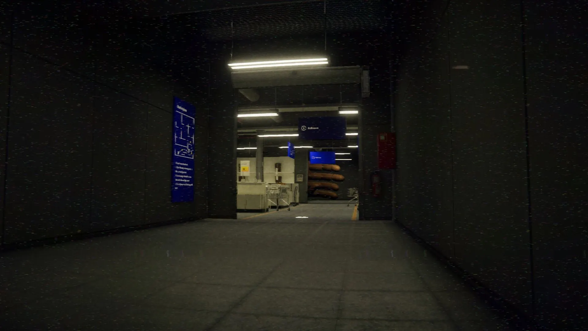 A dark corridor leading to a lit checkout area with blue store signs